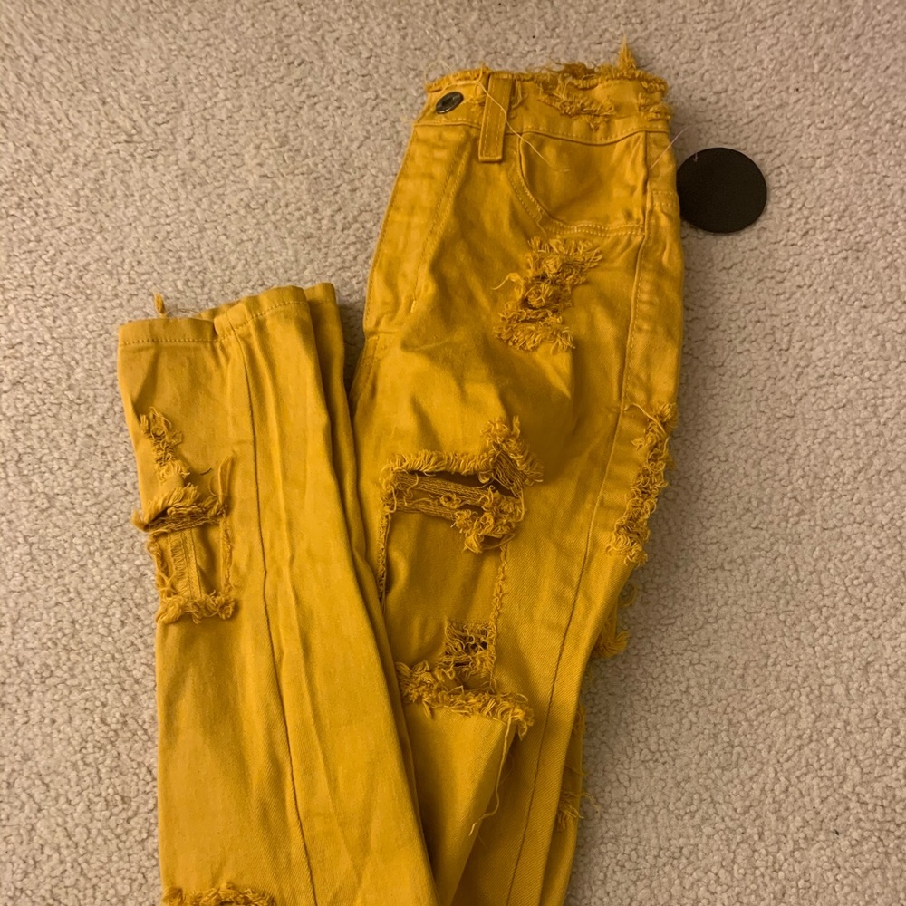 yellow high waisted ripped jeans